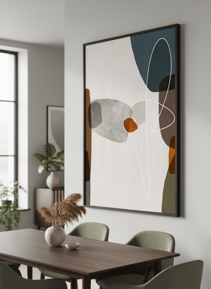 Wall art styled above a dining table in a contemporary home