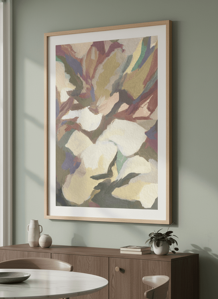 Wall art styled above a dining table in a contemporary home