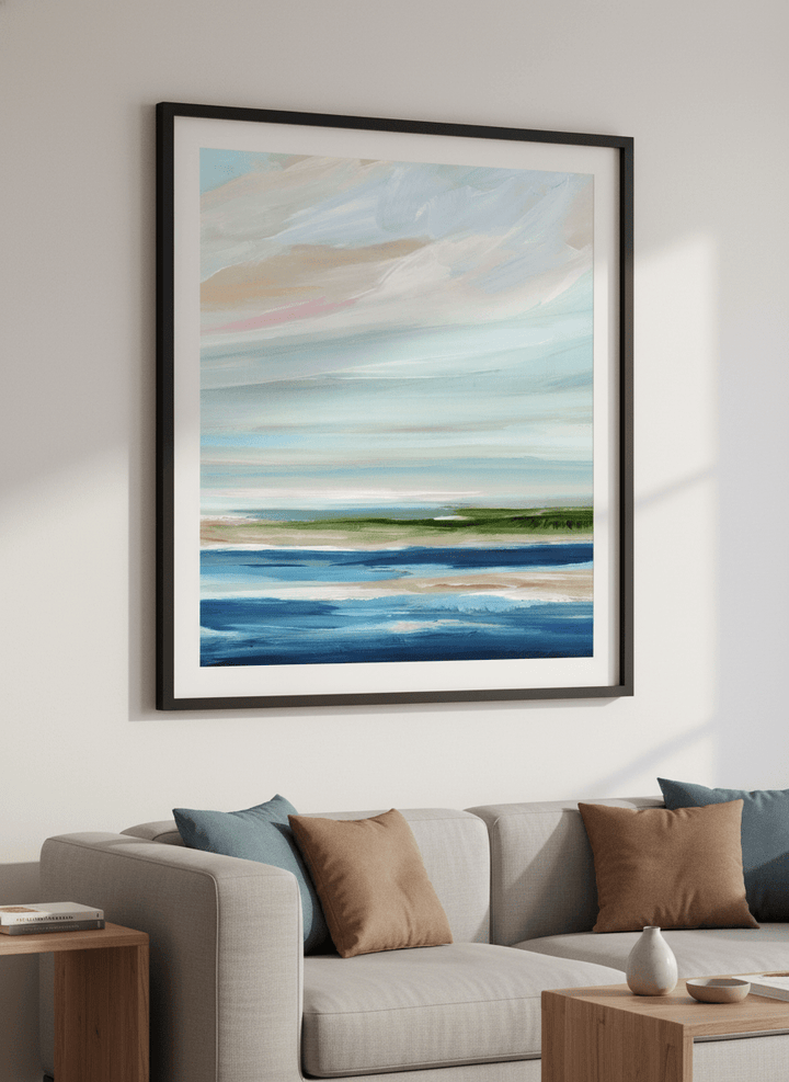 Modern wall art styled above a sofa in a neutral living room