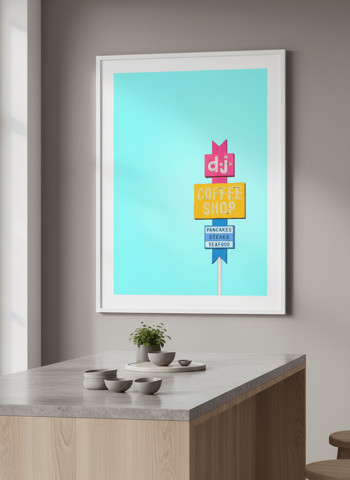 Artwork styled on the wall of a bright modern kitchen