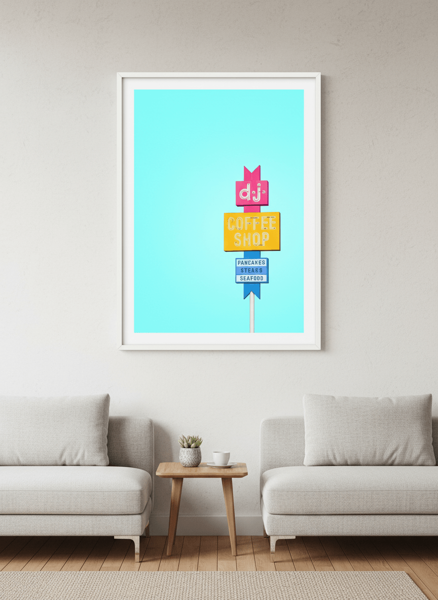 Modern wall art styled above a sofa in a neutral living room