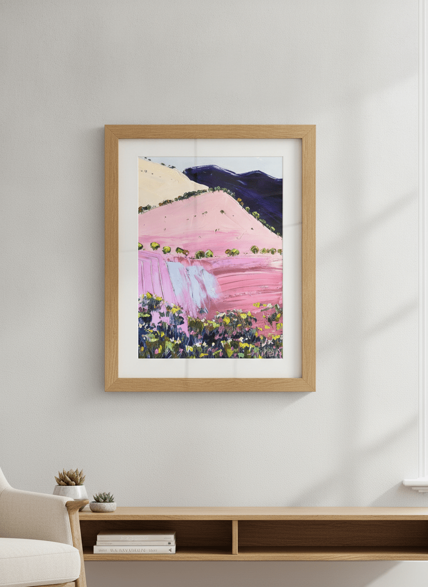 Modern wall art styled above a sofa in a neutral living room