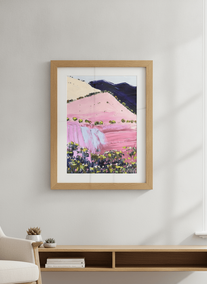 Modern wall art styled above a sofa in a neutral living room