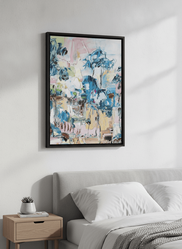 Minimalist artwork displayed in a calm, light-filled bedroom interior