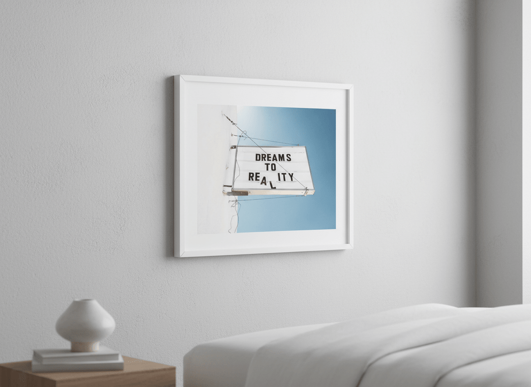 Minimalist artwork displayed in a calm, light-filled bedroom interior