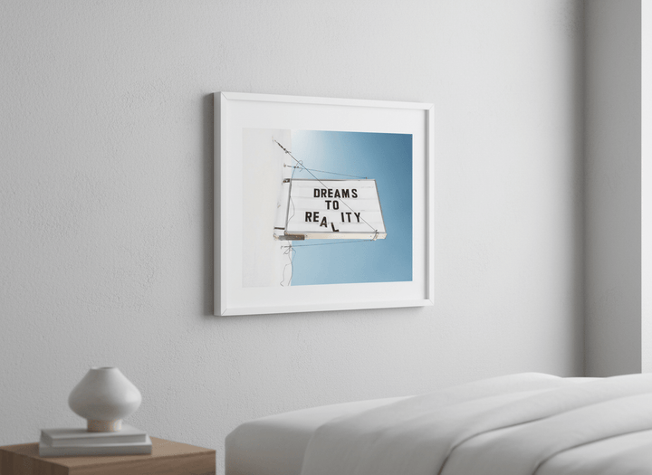 Minimalist artwork displayed in a calm, light-filled bedroom interior