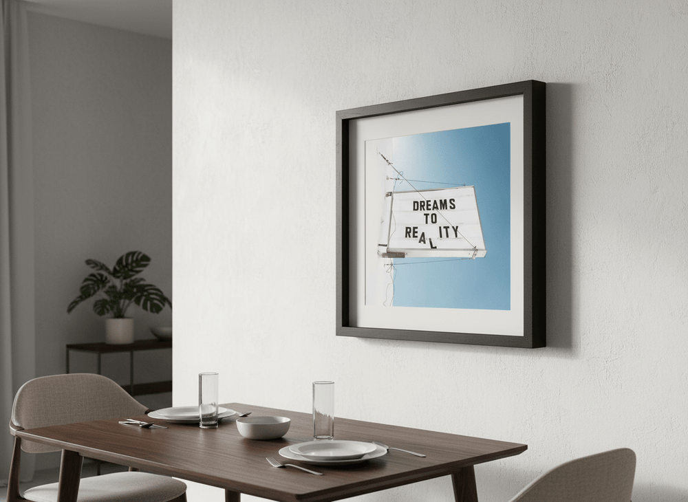 Wall art styled above a dining table in a contemporary home