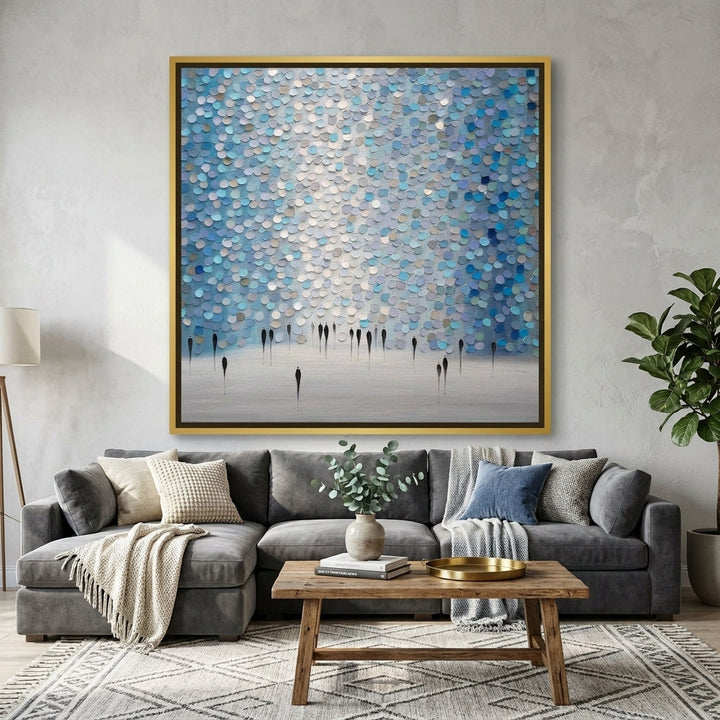 Canvas wall art with a gold leaf surround styled in a neutral living room