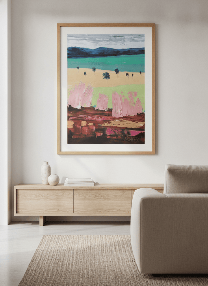 Modern wall art styled above a sofa in a neutral living room