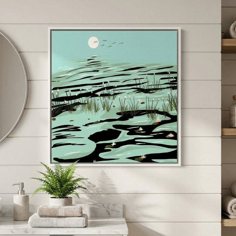 Canvas wall art with a white surround styled in a clean minimalist bathroom