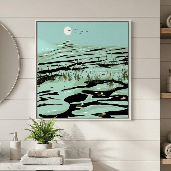 Canvas wall art with a white surround styled in a clean minimalist bathroom
