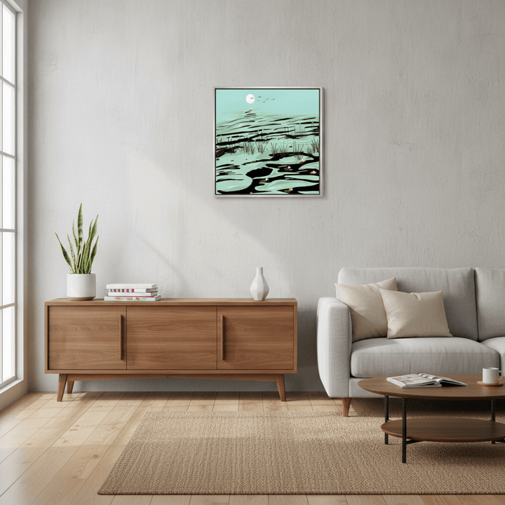 Canvas wall art with a silver leaf surround styled in a neutral living room
