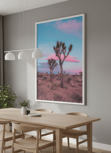 Wall art styled above a dining table in a contemporary home