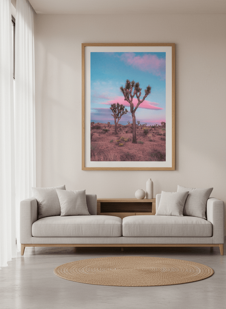 Modern wall art styled above a sofa in a neutral living room