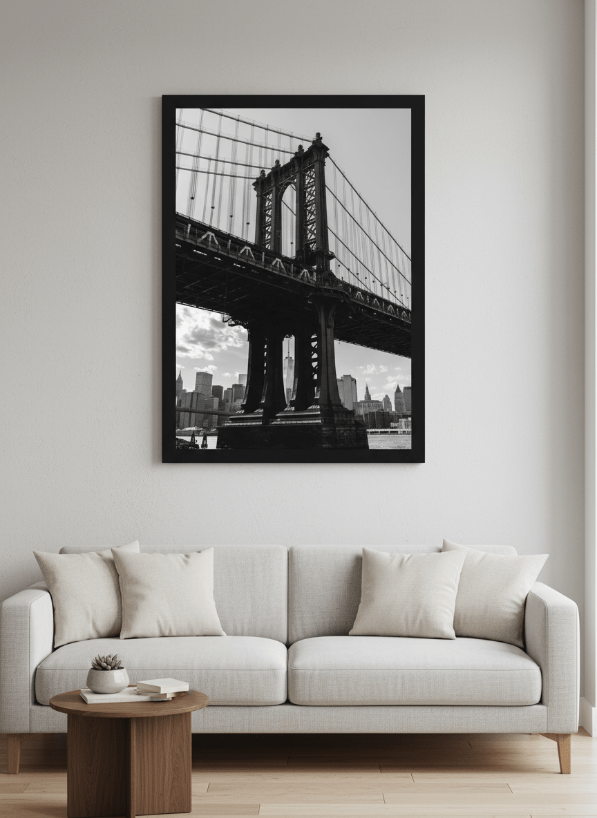 Modern wall art styled above a sofa in a neutral living room