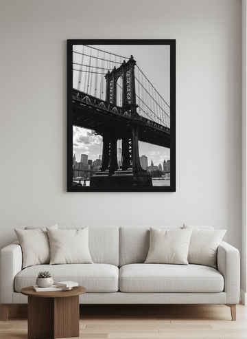 Modern wall art styled above a sofa in a neutral living room