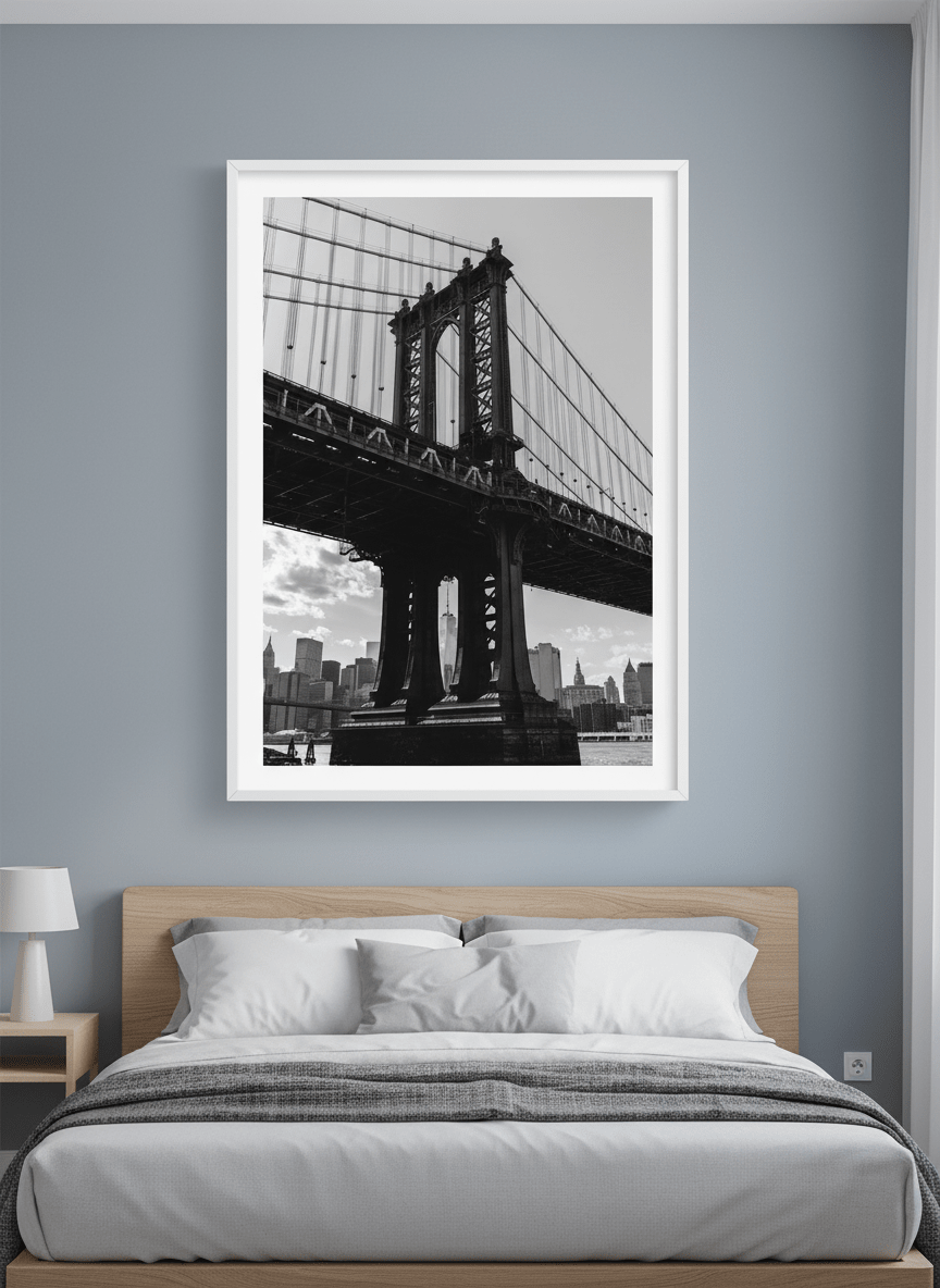 Minimalist artwork displayed in a calm, light-filled bedroom interior