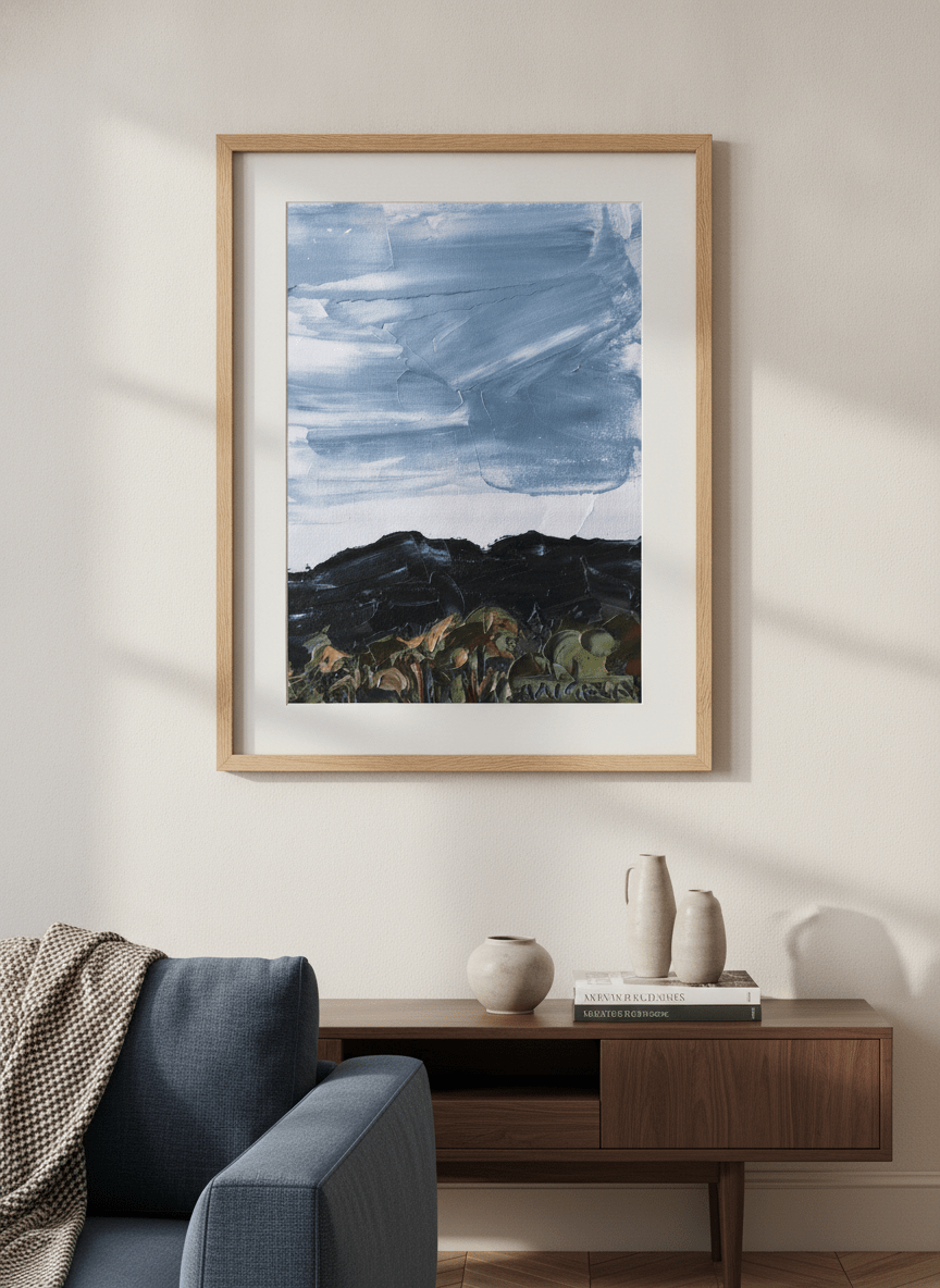 Modern wall art styled above a sofa in a neutral living room