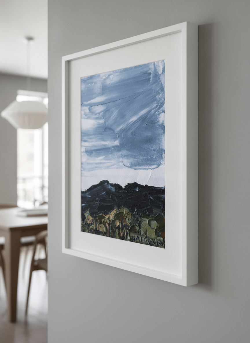 Wall art styled above a dining table in a contemporary home
