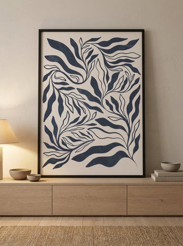 Modern wall art print standing on a sideboard in a warm Japandi bedroom
