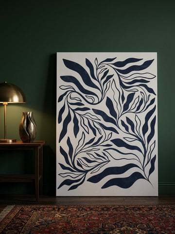 Stretched canvas wall art leaning against the wall in a moody bedroom
