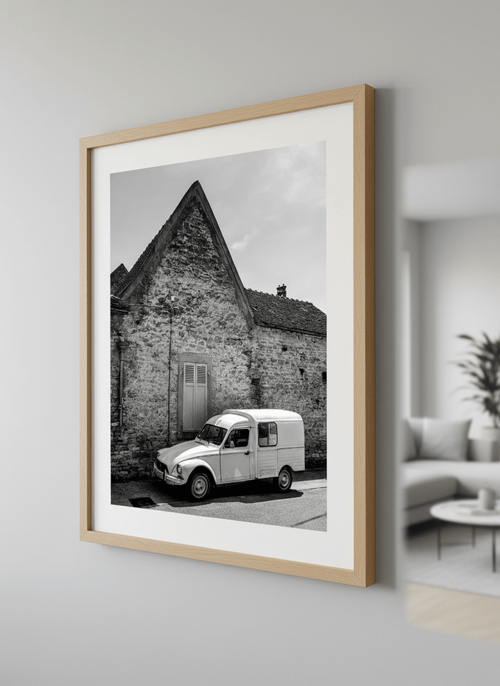 Modern wall art styled above a sofa in a neutral living room