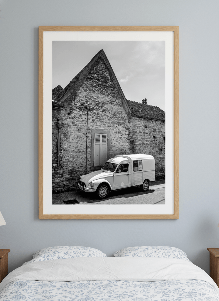 Minimalist artwork displayed in a calm, light-filled bedroom interior