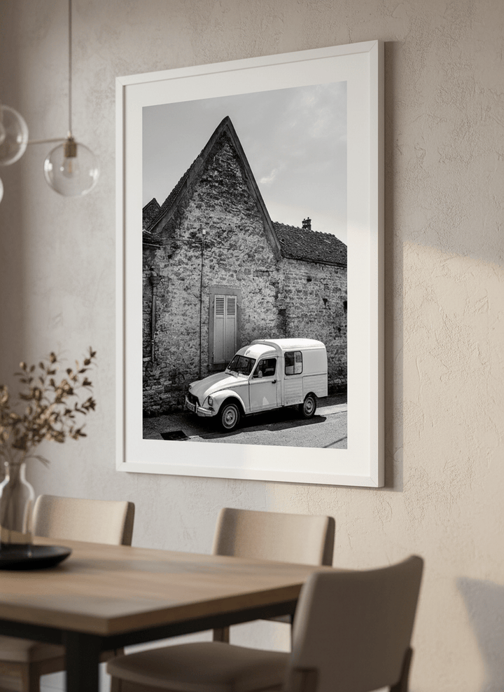 Wall art styled above a dining table in a contemporary home
