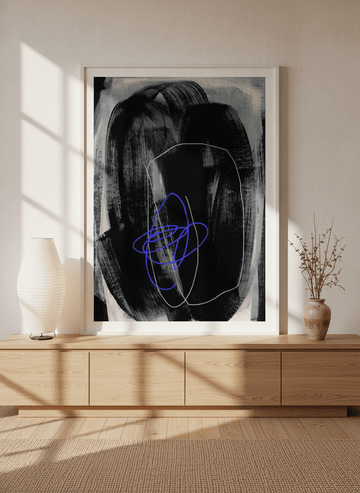 Modern wall art print standing on a sideboard in a warm Japandi home office