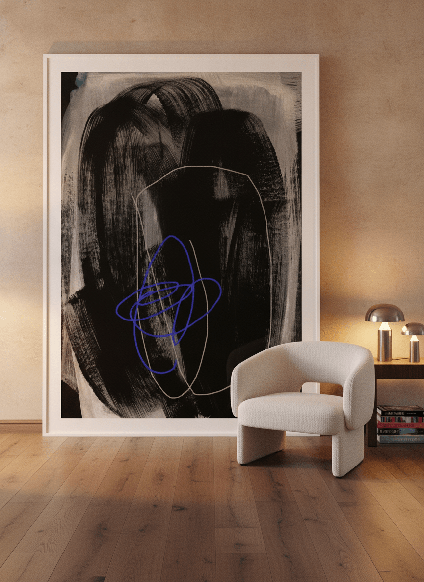 Oversized statement modern wall art print leaning against the wall in a luxe living room