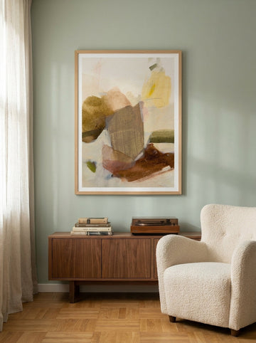 Modern wall art print styled on the wall in a mid-century living room