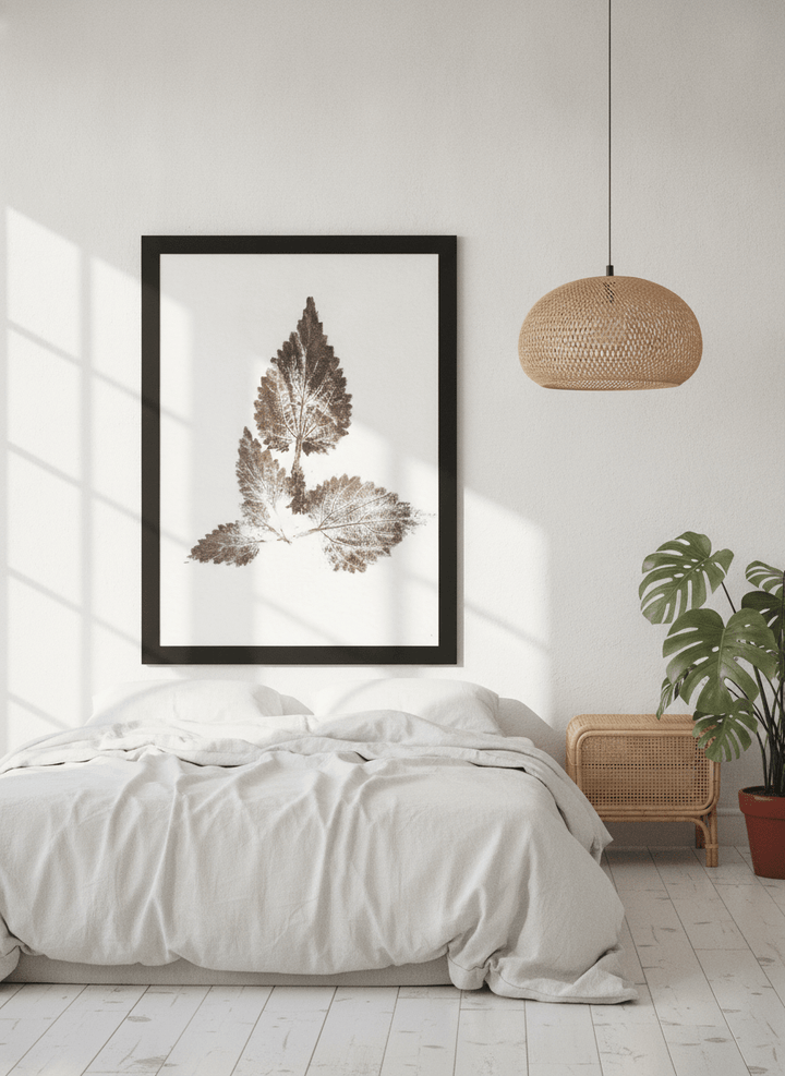 Oversized statement modern wall art print styled on the wall in a bright Scandinavian bedroom