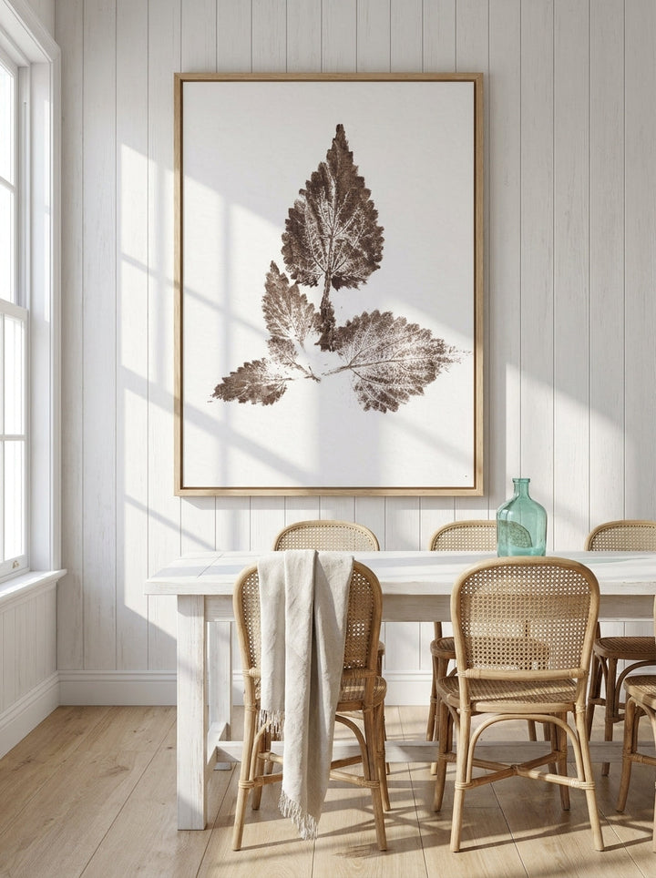 Oversized statement modern wall art print styled on the wall in a coastal dining room