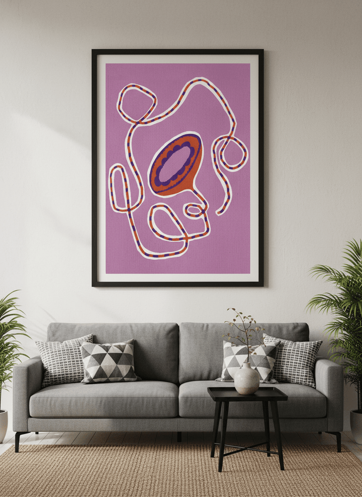 Modern wall art styled above a sofa in a neutral living room