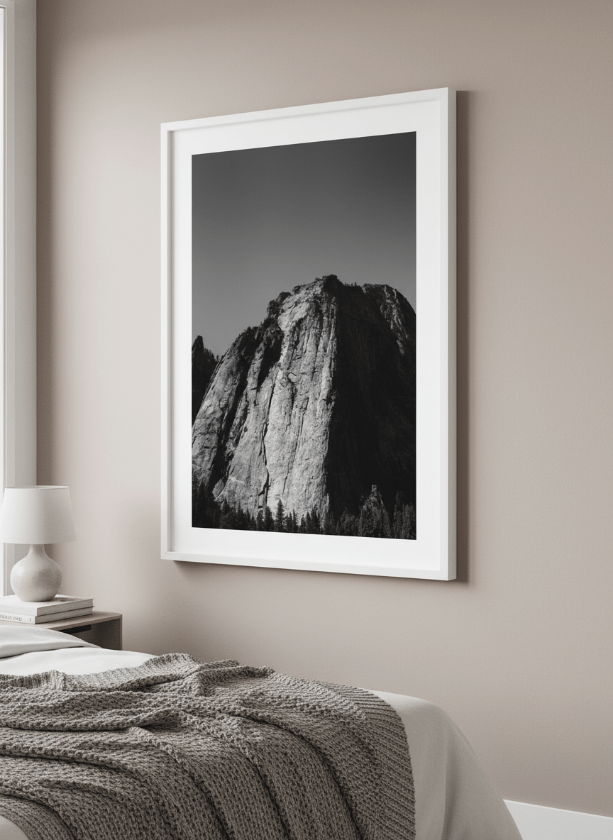 Minimalist artwork displayed in a calm, light-filled bedroom interior