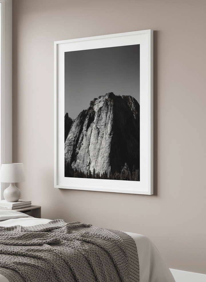 Minimalist artwork displayed in a calm, light-filled bedroom interior