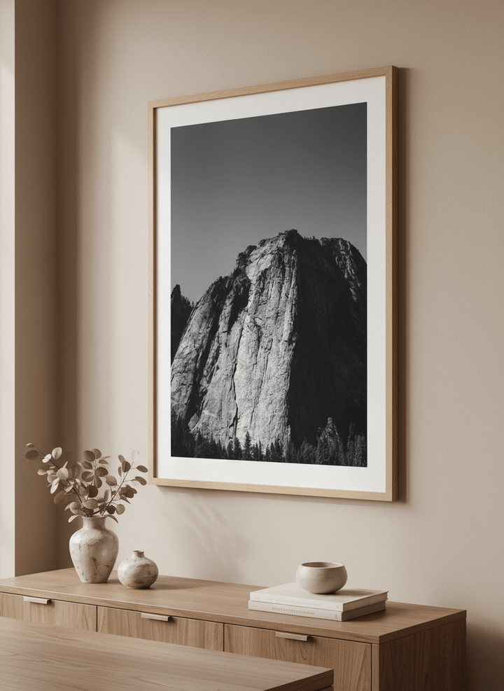 Wall art styled above a dining table in a contemporary home