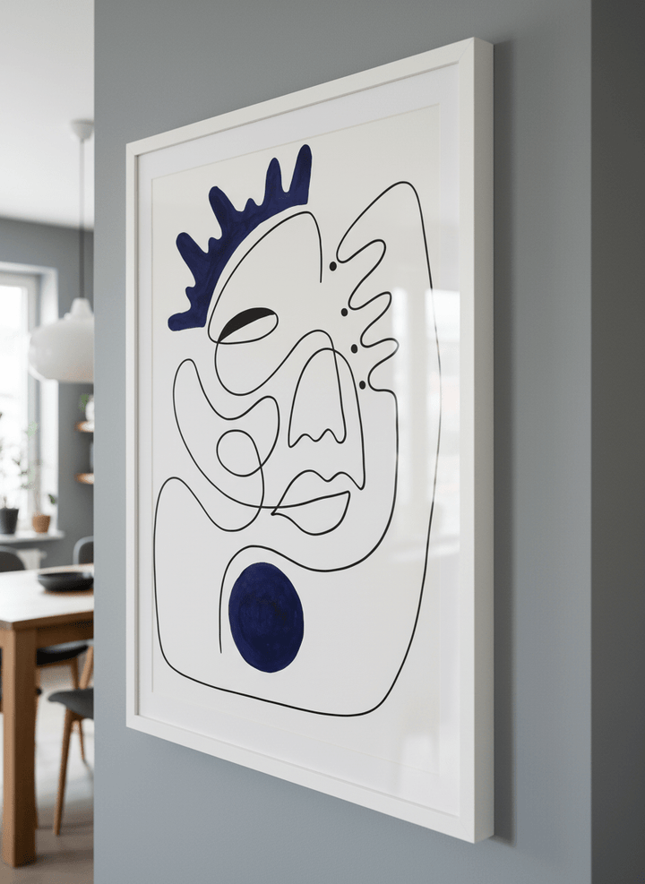 Wall art styled above a dining table in a contemporary home