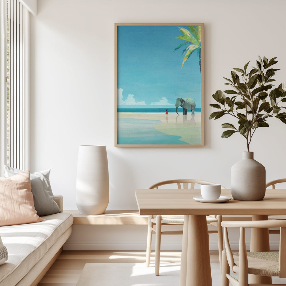 beach artwork above a table with decor items in a living room.