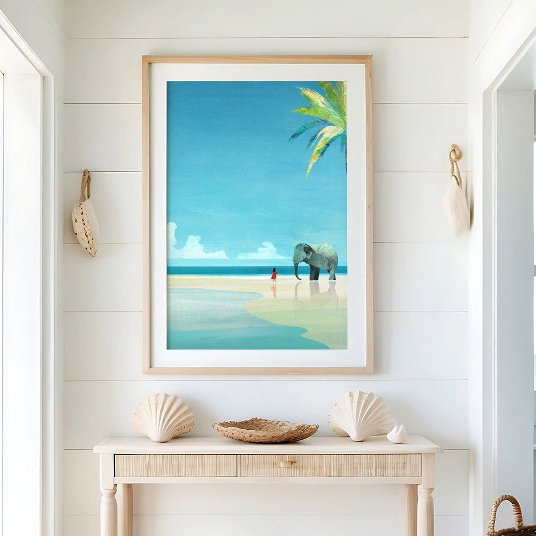 Beach-themed decor in a room with a console table, seashells, and a beach scene painting.