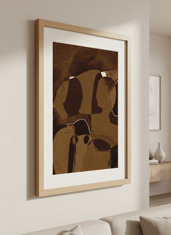Modern wall art styled above a sofa in a neutral living room