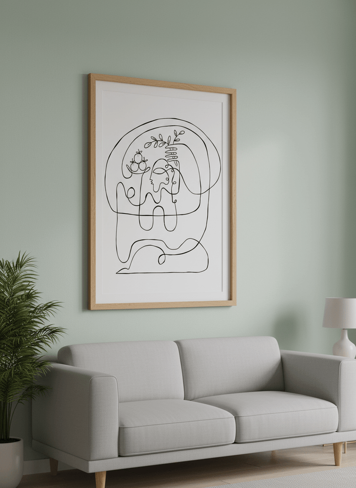 Modern wall art styled above a sofa in a neutral living room