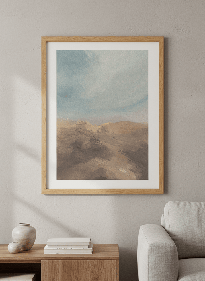 Modern wall art styled above a sofa in a neutral living room