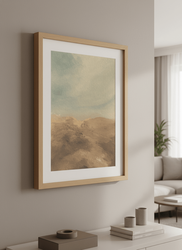 Modern wall art styled above a sofa in a neutral living room
