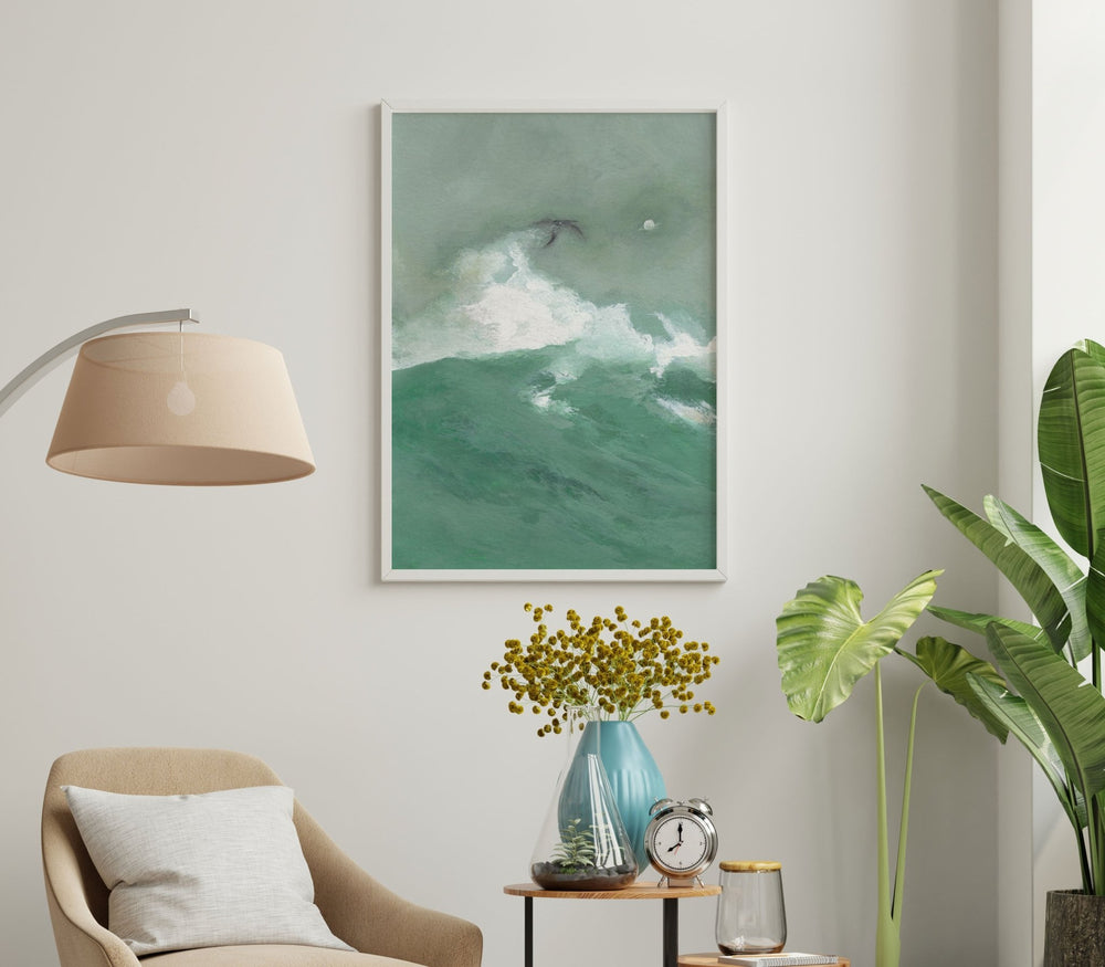 Living room with a painting of a wave, chair, lamp, and decorative items.