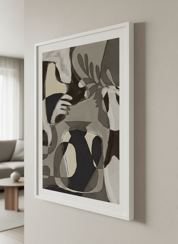 Modern wall art styled above a sofa in a neutral living room