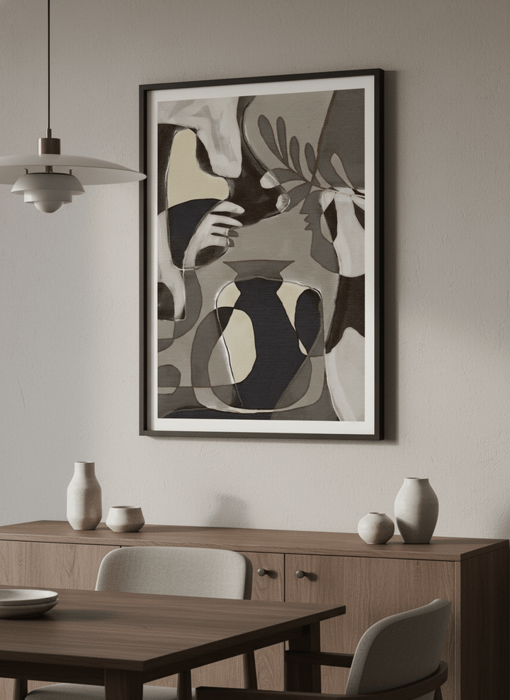 Wall art styled above a dining table in a contemporary home