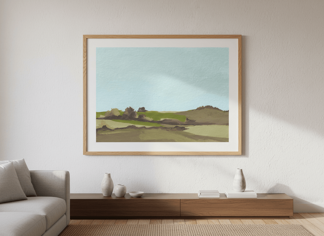 Modern wall art styled above a sofa in a neutral living room