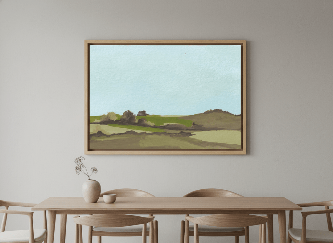 Wall art styled above a dining table in a contemporary home