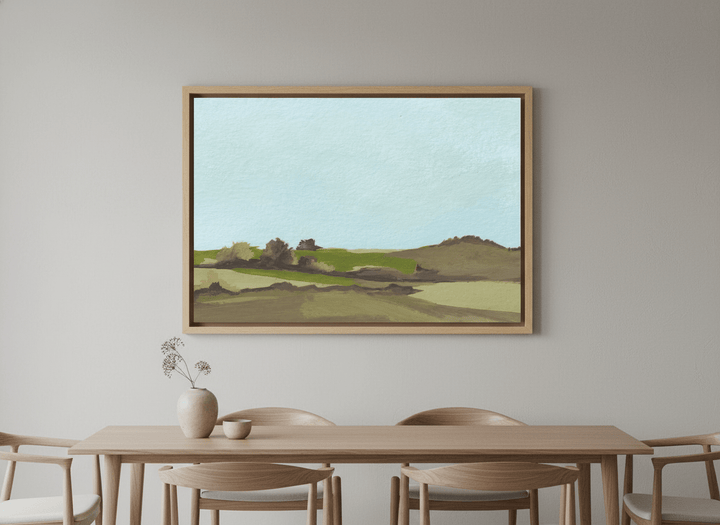 Wall art styled above a dining table in a contemporary home